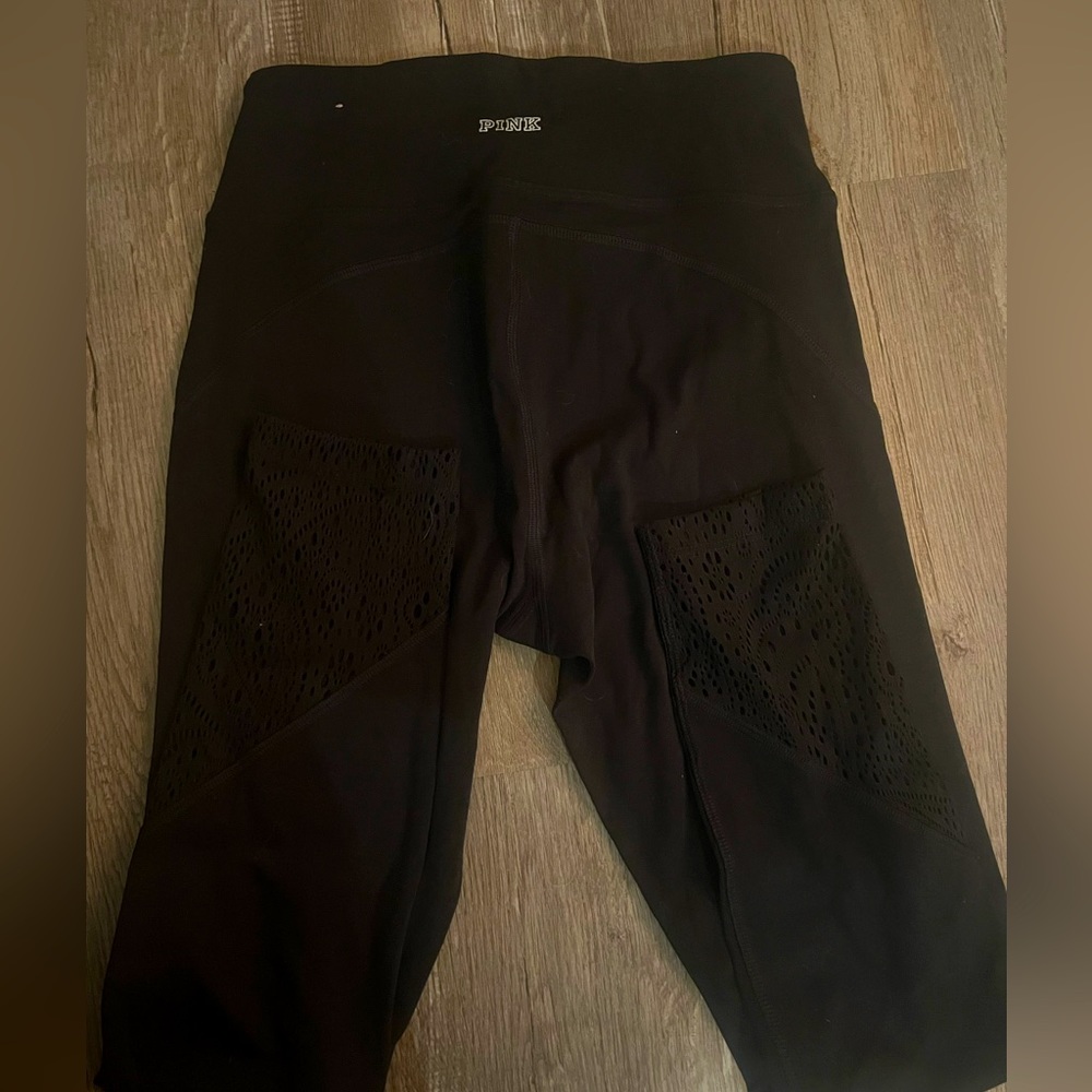 Pink leggings with little designs on the ankles